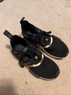 Women’s adidas NMD_R1 Black Sneakers with Gold Trim